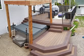 Stairs and composite deck with railings.